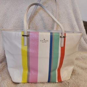 Kate Spade cream tote bag w/ pink, blue, green, orange, yellow and purple stripe